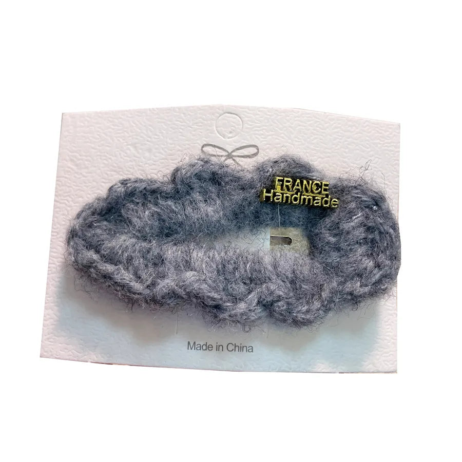 Elegant water drop shaped lamb fur hair accessory, perfect for adding a chic touch to any outfit.