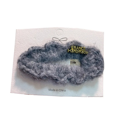 Elegant water drop shaped lamb fur hair accessory, perfect for adding a chic touch to any outfit.