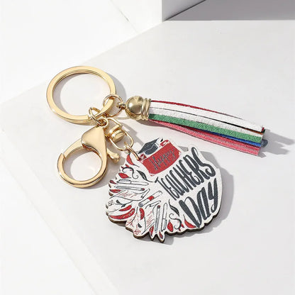 Sophisticated wooden keychain with a trendy rainbow tassel, designed for discerning teachers and graduates.