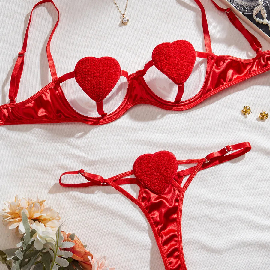 Luxurious women's sexy lingerie set featuring a heart shape design, perfect for intimate occasions like honeymoons, including a sleek thong and delicate bra.