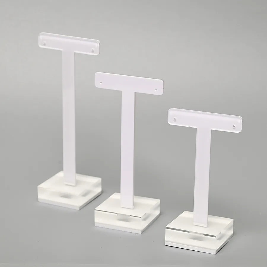 Elegant T-Shape Organic Glass Jewelry Display Stand designed for showcasing minimalist earrings, perfect for luxurious storage solutions.