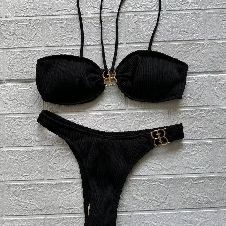 Chic detail of women's sexy low waist bikini, featuring a trendy solid colour design, perfect for summer beach elegance.