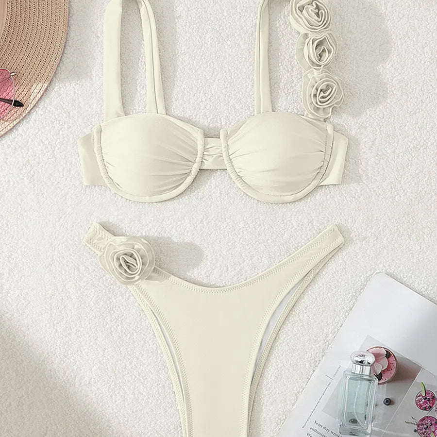 Fashion-forward model showcasing the women's solid colour flower bikini set by WholesaleHQ, epitomising summer elegance and beachside glamour.