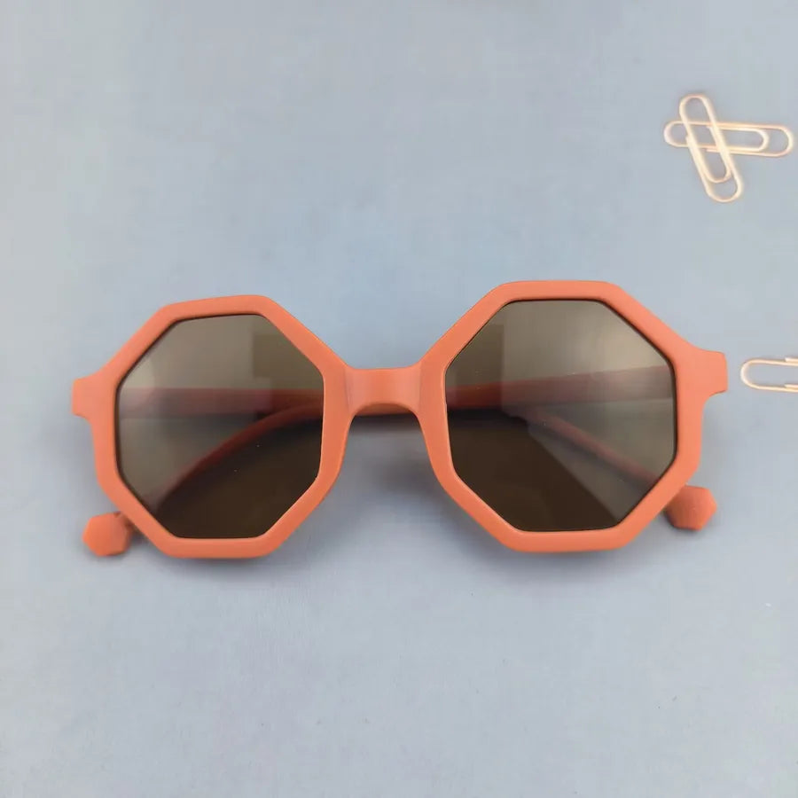 Cute modern design of unisex children's sunglasses showcasing a trendy geometric pattern, ideal for all seasons.