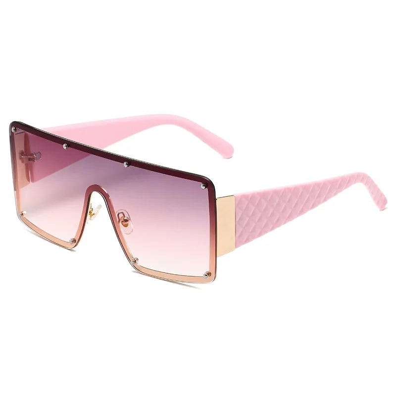 Chic women's sunglasses in a bold square shape with an extravagant geometric pattern, embodying modern luxury.