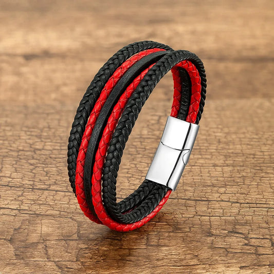 Close-up view of a handmade vintage punk geometric wristband, highlighting the intricate geometric patterns and metal button detail in red and black.