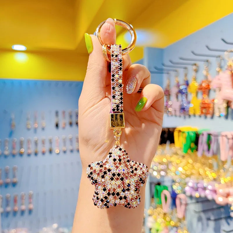 Elegant cartoon full drill star keychain with a chic tassel, perfect for gifting on special occasions.