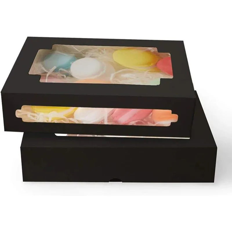 Whimsical white dessert packaging featuring a clear window, ideal for displaying gourmet macarons and exquisite pastries.
