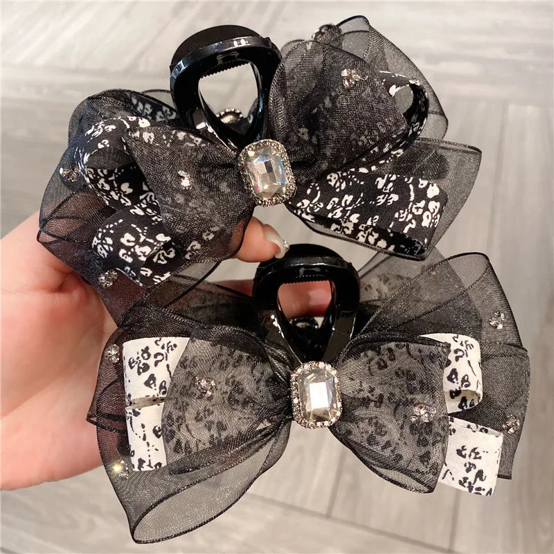 Elegant floral silk butterfly knot shark clip hair accessory for women, showcasing a luxurious pastoral design in vibrant colours, perfect for enhancing any hairstyle.