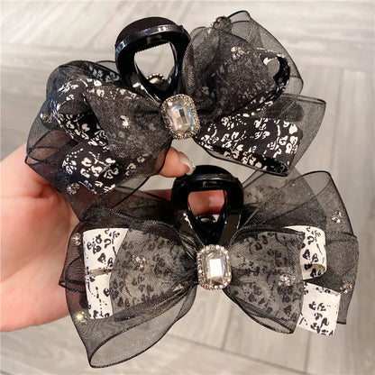Elegant floral silk butterfly knot shark clip hair accessory for women, showcasing a luxurious pastoral design in vibrant colours, perfect for enhancing any hairstyle.