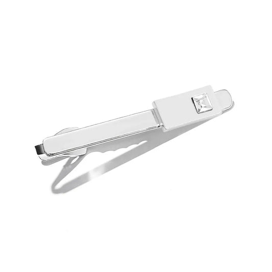 Stylish close-up of the geometric pattern on a luxury men's shirt, showcasing intricate design details and sophisticated accessories like tie clip and cufflinks.