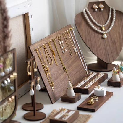 Stylish walnut veneer jewelry display stand highlighting earrings and necklaces with an advanced sense of style, ideal for luxury storage solutions.