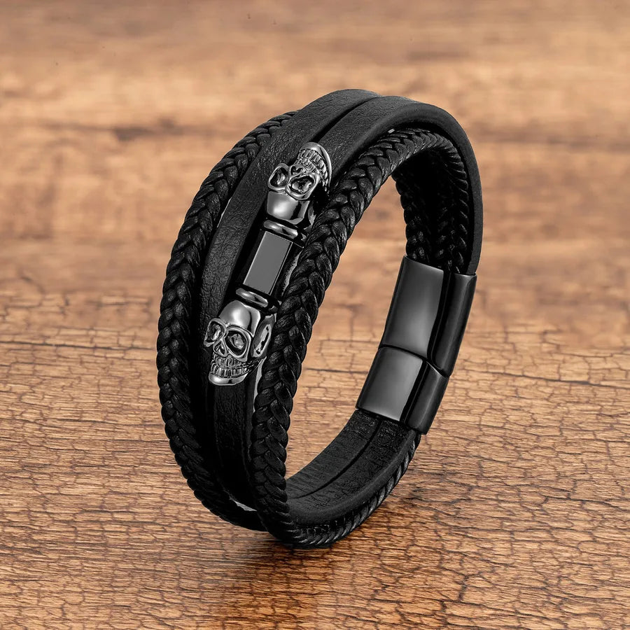 Elegant men's Halloween skull bracelet in leather rope, showcasing a unique handmade design with edgy metal elements, perfect for statement accessories.