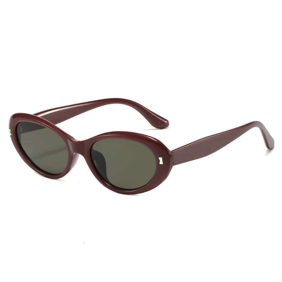 Luxury women's sunglasses showcasing a unique geometric cat-eye design, perfect for enhancing outdoor and vacation looks.