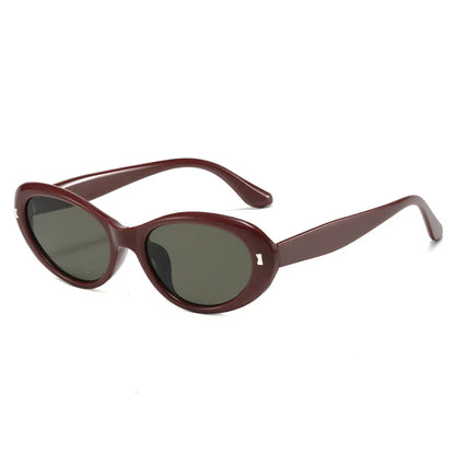 Luxury women's sunglasses showcasing a unique geometric cat-eye design, perfect for enhancing outdoor and vacation looks.