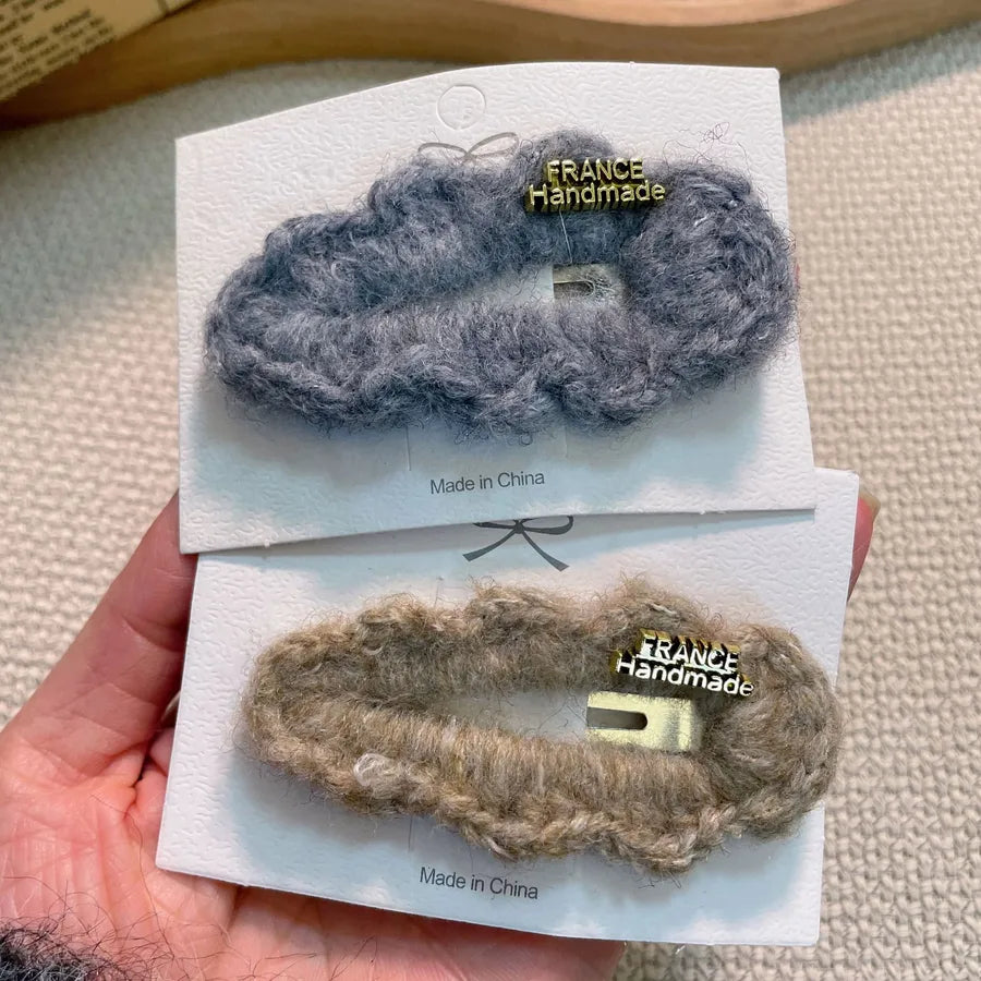Luxurious plush lamb fur hair clip for women, ideal for stylish high-end fashion hairstyles.