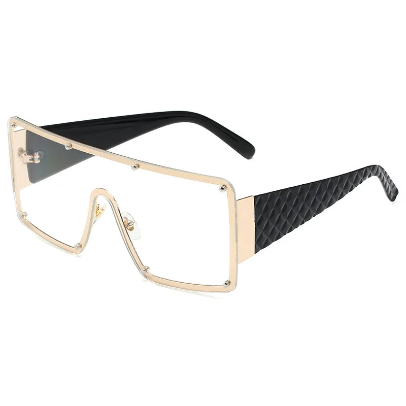 Ultimate statement piece: gold and black geometrically patterned frameless square sunglasses for the modern woman.
