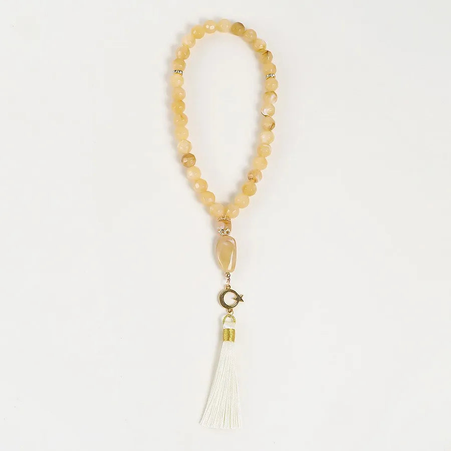 Sophisticated round tassel rosary adorned in pink, blue, and black, expertly crafted from premium acrylic and alloy.