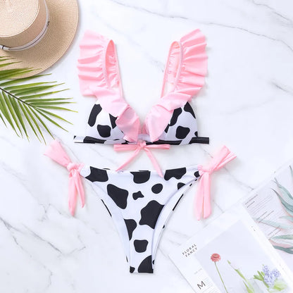 Luxury women's bikini set featuring a stylish cow pattern, designed with ruffles and triangle cups for a sexy look, perfect for beach and pool occasions.