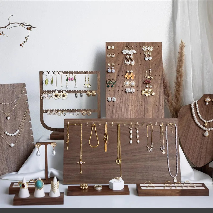 Elegant walnut jewelry display stand showcasing earrings and necklaces with a refined cherry wood grain finish, perfect for luxurious organisation.