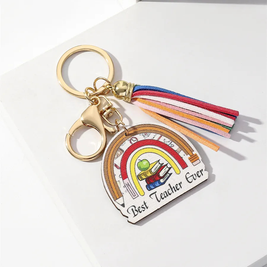 Chic wooden keychain with rainbow tassel embellishment, an exquisite and thoughtful gift for educators.