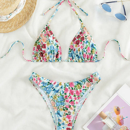 Luxury women's ditsy floral bikini swimwear set featuring triangle cups and low waist design, perfect for beach outings and poolside relaxation.