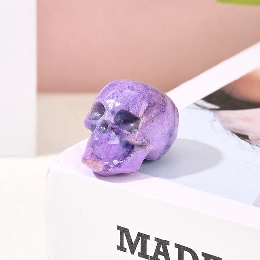 Charming natural stone skull decoration in sky blue and purple, embodying simple elegance for indoor celebrations and gatherings.