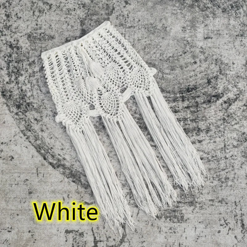 Chic vacation cover-up featuring a vibrant solid colour pattern and stylish tassel accents, ideal for warm summer days.