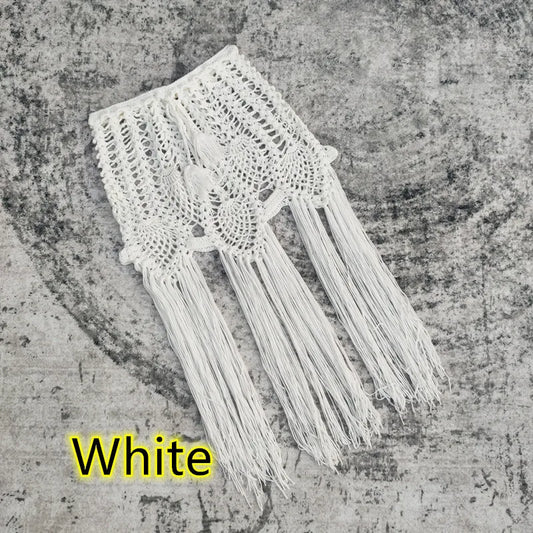 Chic vacation cover-up featuring a vibrant solid colour pattern and stylish tassel accents, ideal for warm summer days.