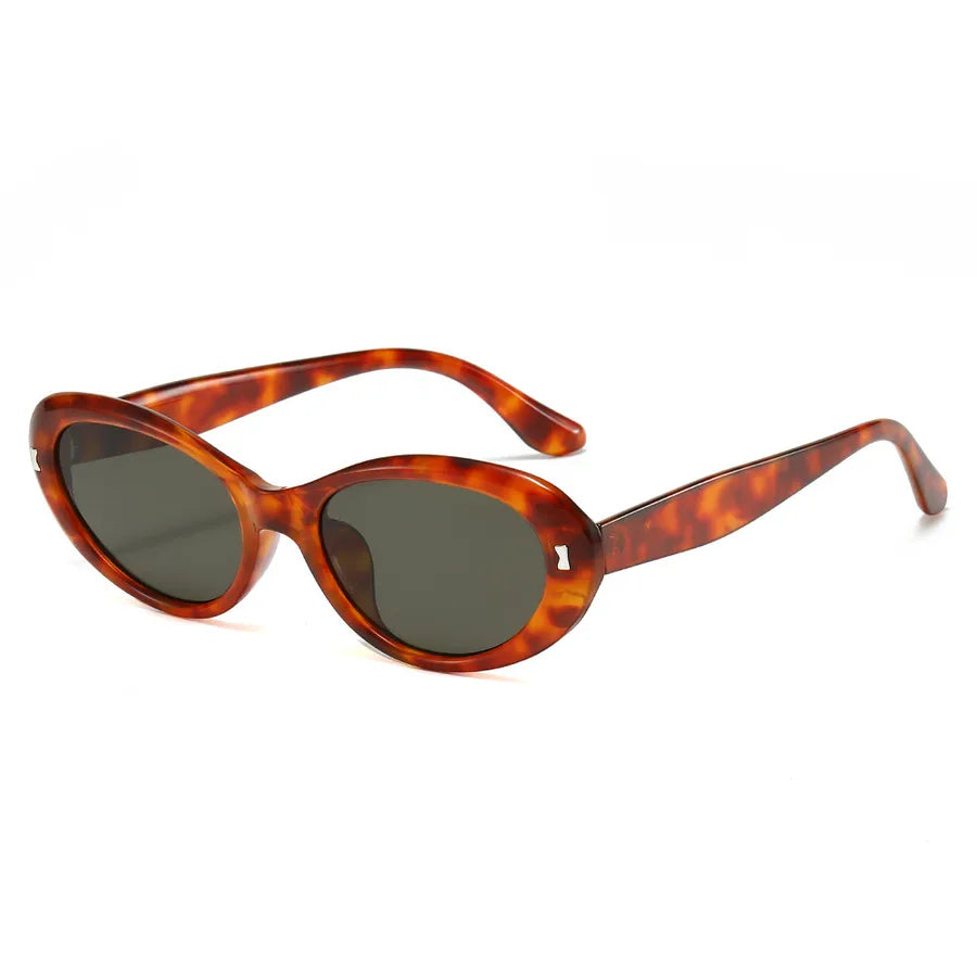 Chic luxury cat-eye sunglasses for women featuring an intricate geometric design, ideal for summer vacations.