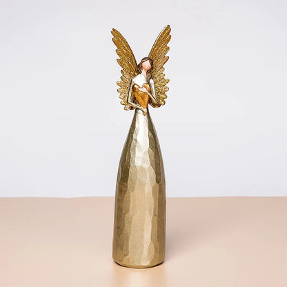 Sophisticated indoor display featuring a golden heart-hugging angel ornament, a fashionable choice for elegant interior decoration.