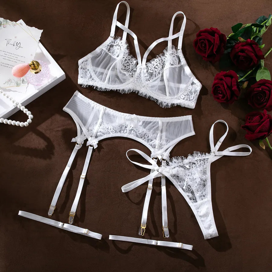 Beautifully styled women's sexy solid colour lingerie set laid out flat, emphasising the delicate fabric and sensual design for a sophisticated look.