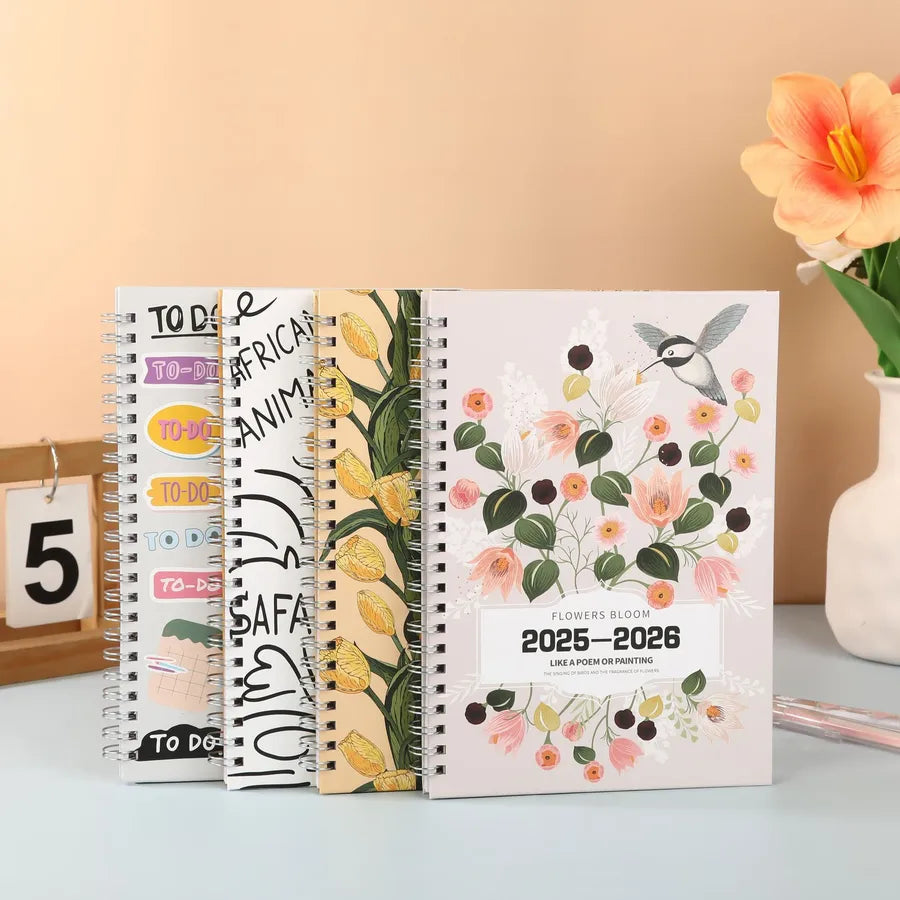 Luxurious A5 floral and giraffe patterned spiral notebook, perfect for academic planners and stylish note-taking, featuring vibrant flower designs and elegant giraffe motifs.