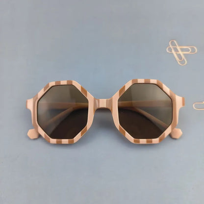 Chic modern children's sunglasses with geometric pattern and cute novelty design, ideal for beach outings.