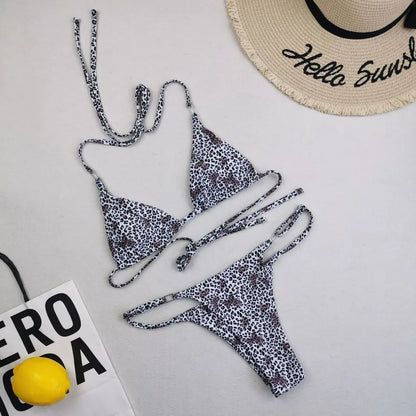 Stylish women's bikini with a luxurious feel, featuring triangle cup bra and mid-waist bikini bottoms for a flattering silhouette.