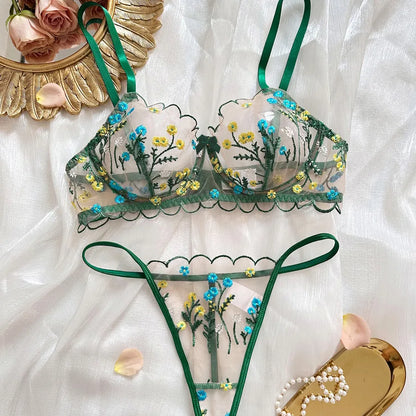 Refined presentation of women's sexy floral lingerie set on a model, highlighting the sheer fabric and elegant design for romantic settings.