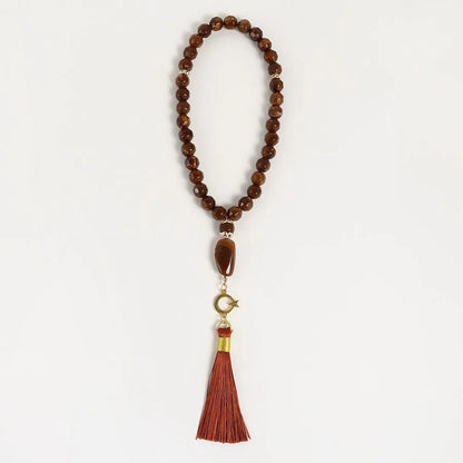 Elegant Presentation of the Unisex Round Tassel Rosary, perfect for formal occasions and crafted with style.