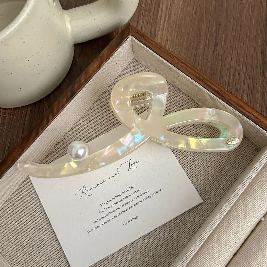 Stylish luxurious shark hair clip for ladies, crafted from premium materials, designed to add a touch of glamour to any hairstyle.