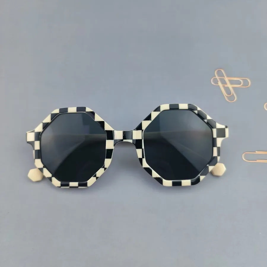 Chic full frame tinted lens sunglasses designed for children, combining modern design with cuteness.