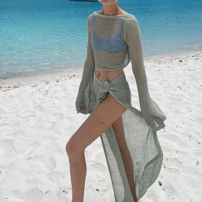Elegant women’s summer knit skirt co-ord set showcasing a chic silhouette with long sleeves, ideal for beachside relaxation.