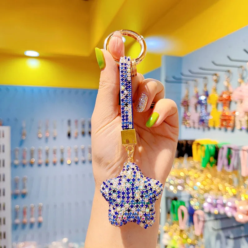 Charming keychain featuring a star design, complete with a delicate tassel, ideal for celebrating Christmas and Valentine's Day.