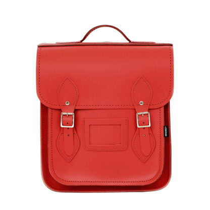 Handmade Leather City Backpack in Pillar Box Red showcasing elegant design with silver nickel buckles and stylish matching stitching, perfect for urban adventures.