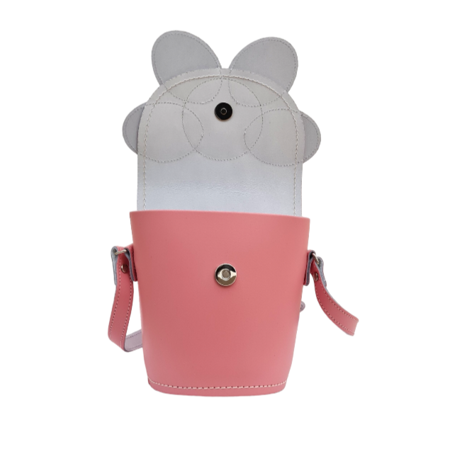 Stylish pastel pink leather barrel bag with adjustable strap, perfect for day-to-night transitions and designed for the modern fashionista.