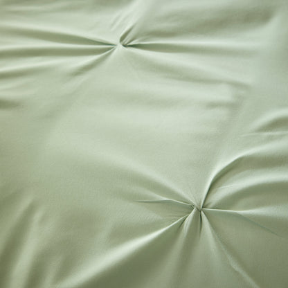 Elegant sage green microfibre duvet cover set with pintuck design, exuding luxury and comfort in a beautifully styled bedroom.