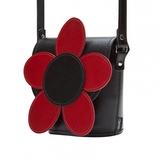 Close-up view of the exquisite red leather texture and intricate poppy floral design, illustrating the beauty and quality of this adjustable crossbody barrel bag.