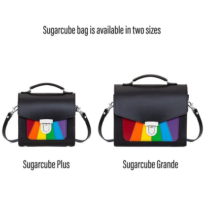 Fashionable Handmade Leather Sugarcube Handbag displayed as a chic clutch, representing empowerment and modern design with the Pride Rainbow Flag.