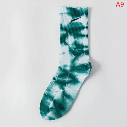 Luxurious Women's Tie-Dye Middle Tube Socks in a beautiful teal and white design, offering vibrant comfort for all-day style.
