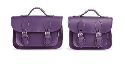 Versatile handmade purple leather micro satchel worn as a crossbody bag, highlighting its adjustable strap and small plus size options for fashion-forward individuals.