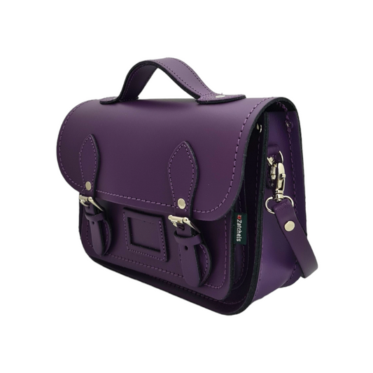 Elegant handmade purple leather midi satchel featuring exquisite craftsmanship, showcasing luxurious design elements and nickel silver buckles.