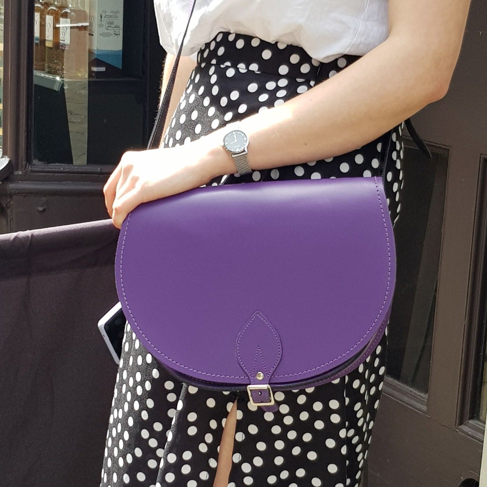 Interior view of the handmade purple leather saddle bag, featuring a spacious compartment that balances style and functionality, perfect for organizing essentials.